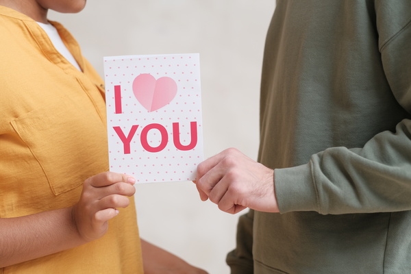 Biracial Couple Holds Valentine Day Card